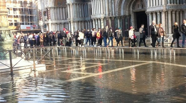 Using walkways to avoid a flooded St Mark's Square