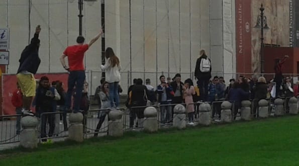 Tourists posing for photos